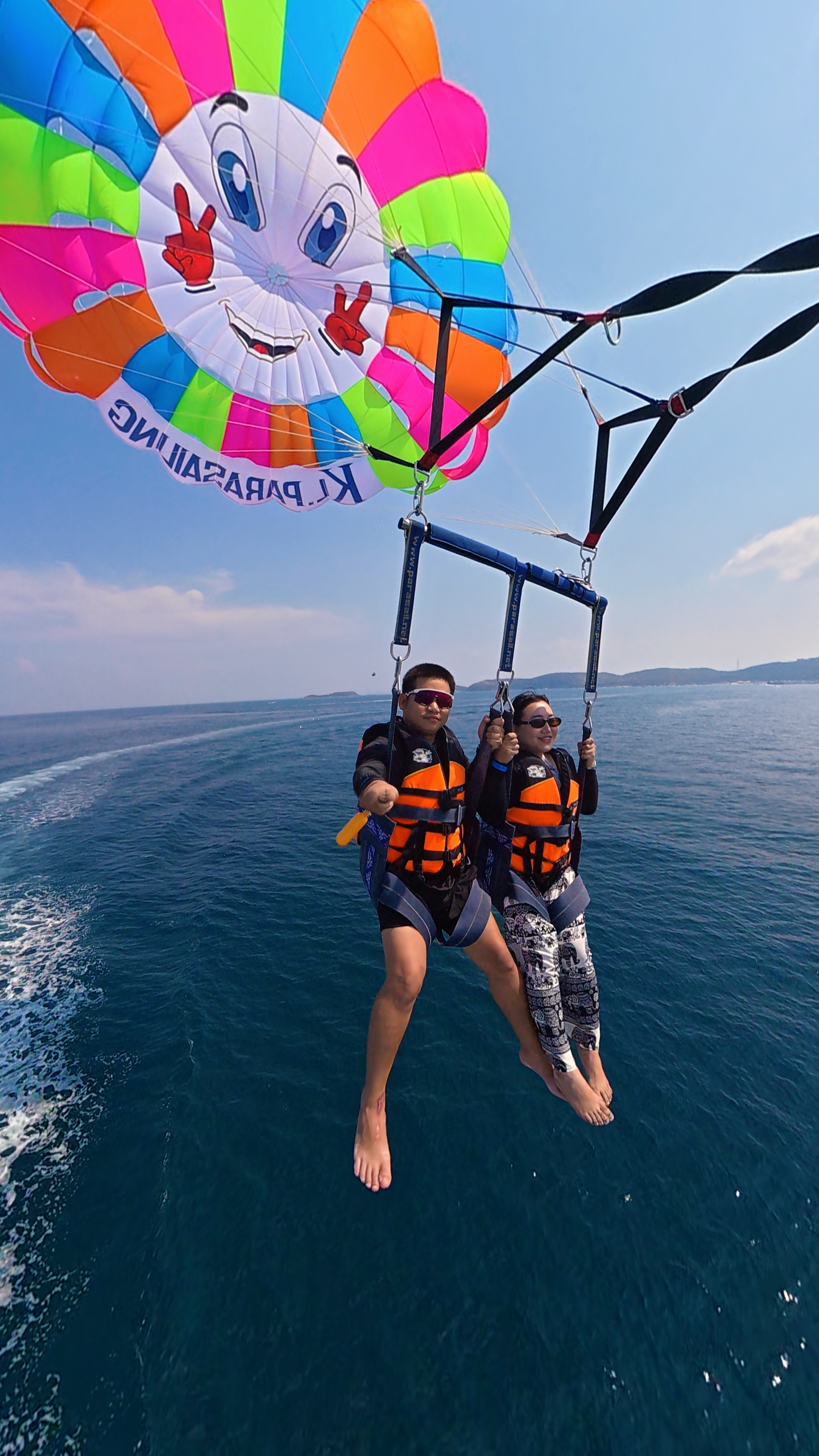 Parasailing above a blue ocean