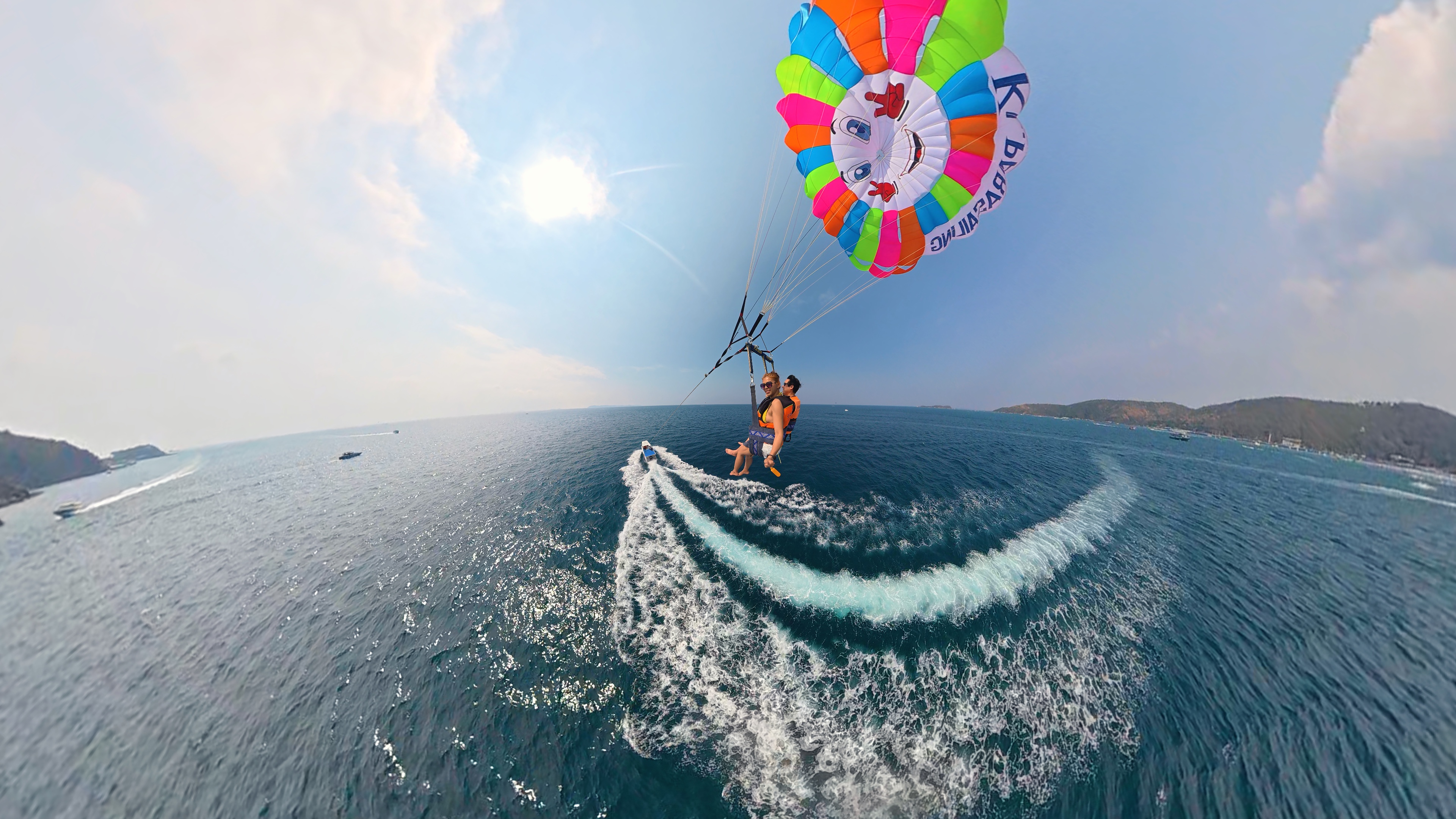 Person parasailing above the water